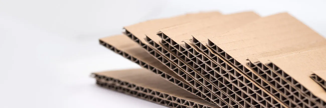 Sustainable corrugated paper packaging solution using recycled materials and minimalist design, suitable for e-commerce