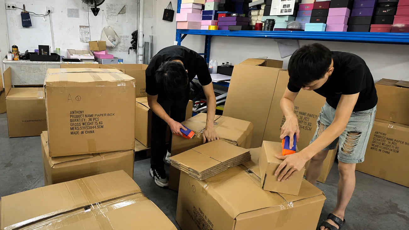 The CrownWin packaging team is packaging products for customers