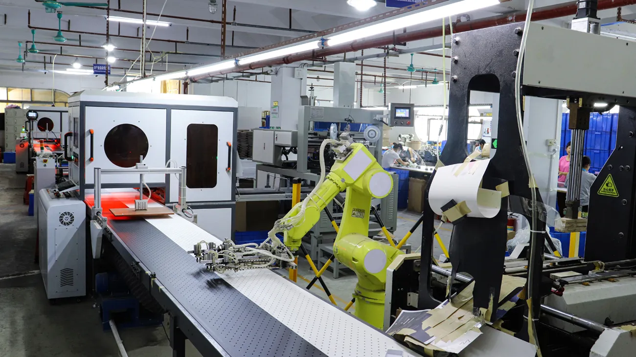 Automated die‑cutting workshop inside China custom packaging factory for custom printed paper boxes manufacturing