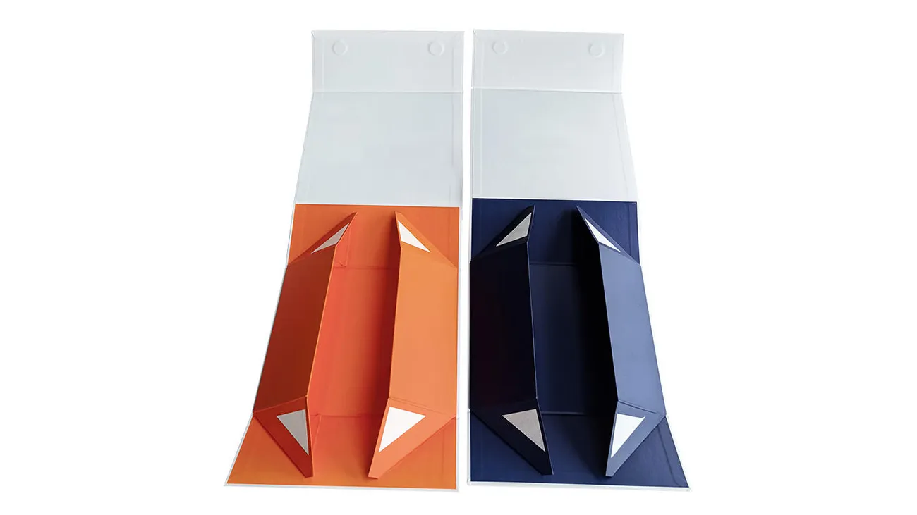 Samples of two folding paper box designs: one orange and one dark blue.